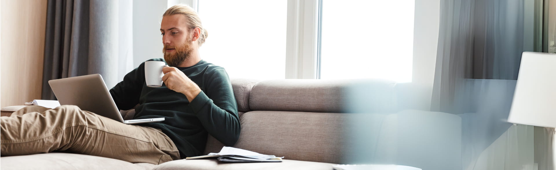 Man working on laptop to pay natural gas bill